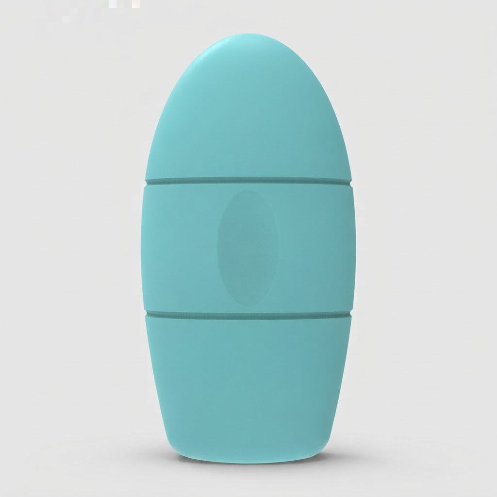 A light blue-green silicone personal massager with a rounded, egg-shaped design and a central oval button, shown on a neutral light gray background.